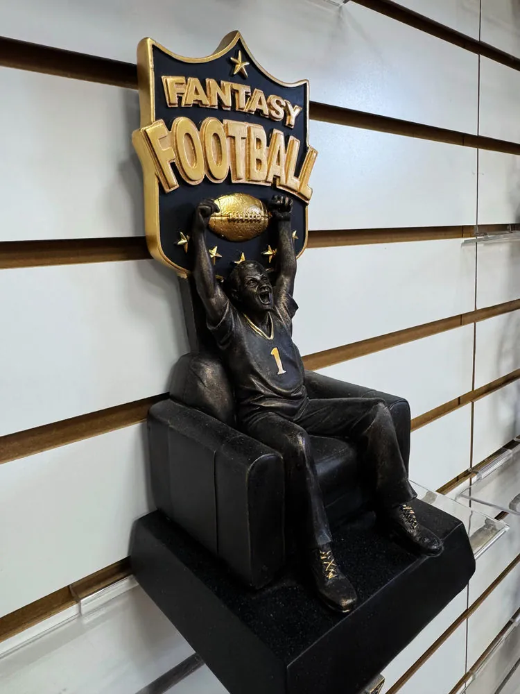 Fantasy football trophy on the showroom wall