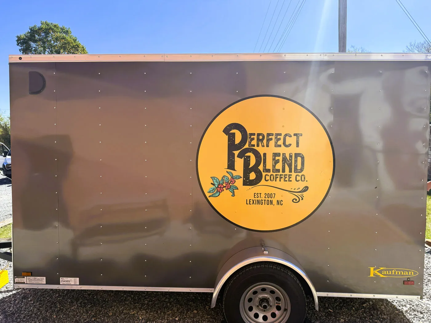 Printed logo graphic applied to the side of a coffee company trailer
